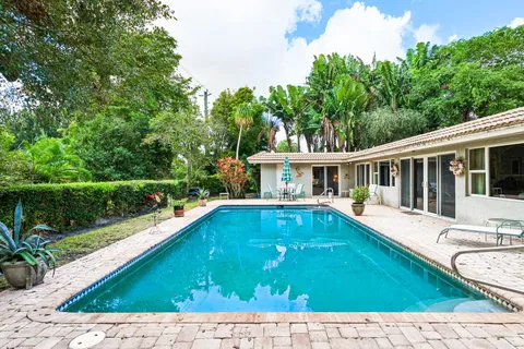 $995,000 | 416 South Country Club Drive, Atlantis, FL 33462