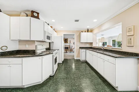 $995,000 | 416 South Country Club Drive, Atlantis, FL 33462