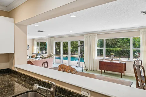 $995,000 | 416 South Country Club Drive, Atlantis, FL 33462