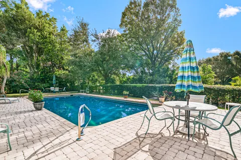 $995,000 | 416 South Country Club Drive, Atlantis, FL 33462