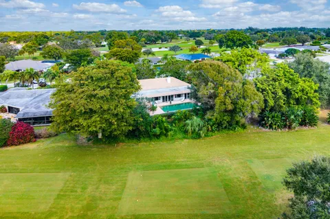 $995,000 | 416 South Country Club Drive, Atlantis, FL 33462