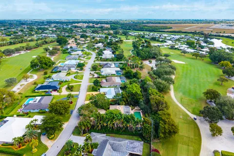 $995,000 | 416 South Country Club Drive, Atlantis, FL 33462
