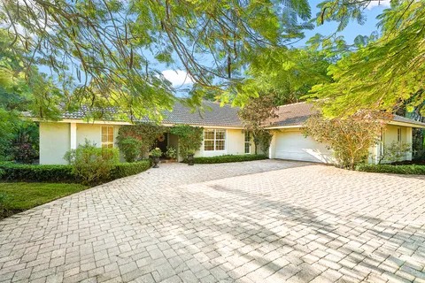 $995,000 | 416 South Country Club Drive, Atlantis, FL 33462