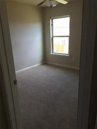a view of a room that has a window in it