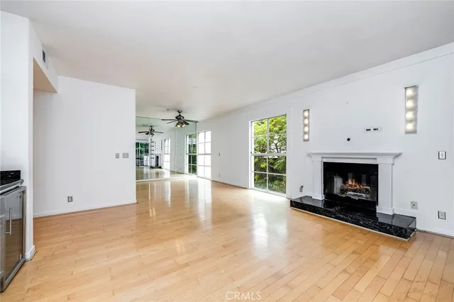 a view of kitchen with furniture and refrigerator