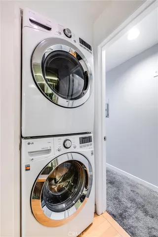 a room with a chair and potted plant