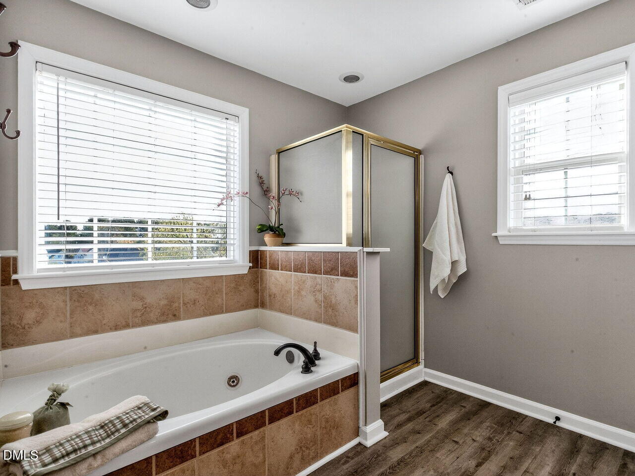 4500 Rivershyre Way Raleigh, NC 27616 - Photo 30 of 42 a bathroom with a tub a window and a shower
