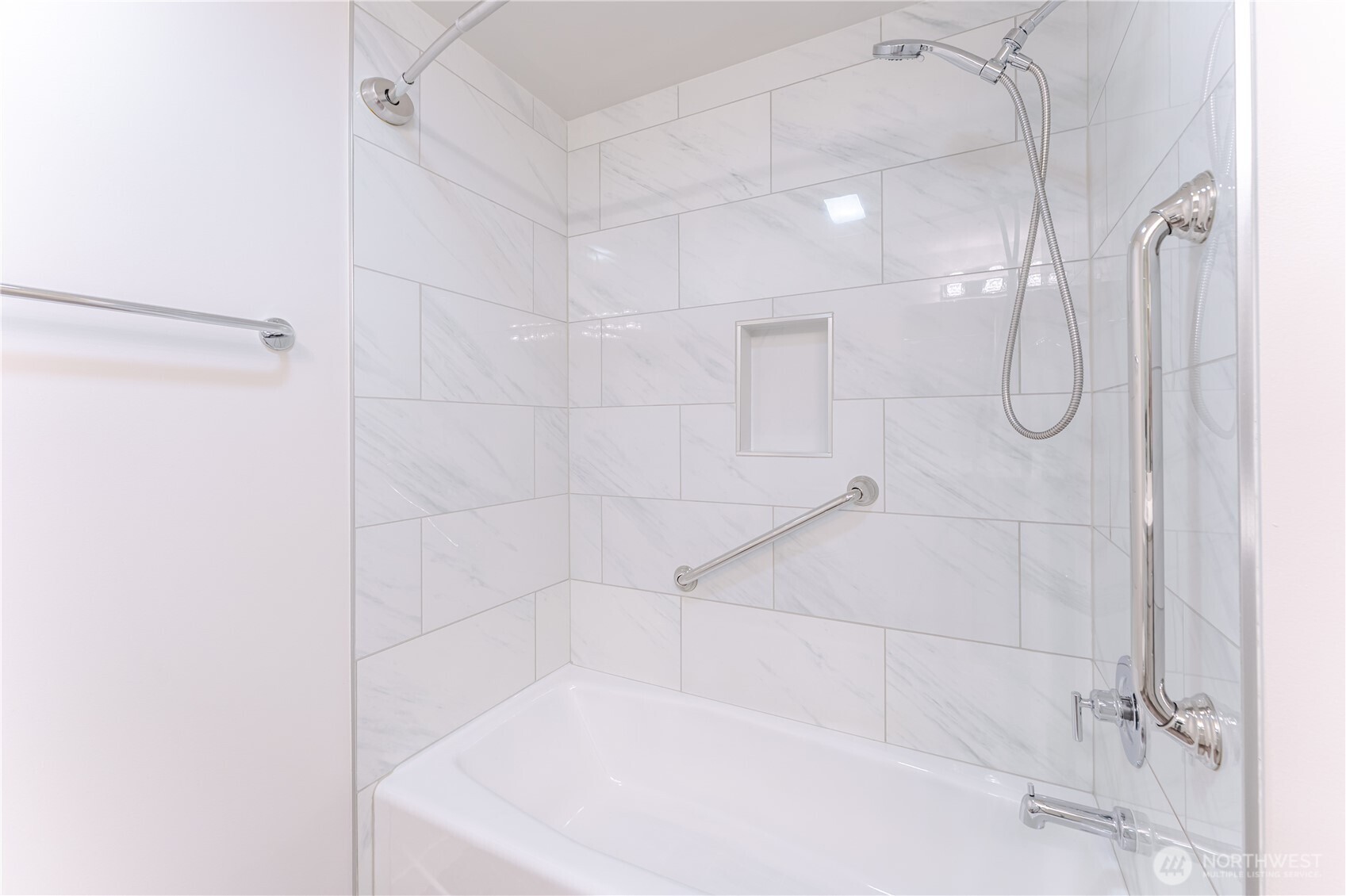 76 Cedar Street, Unit 303 Seattle, WA 98121 - Photo 16 of 29 a bathroom with a bathtub and shower