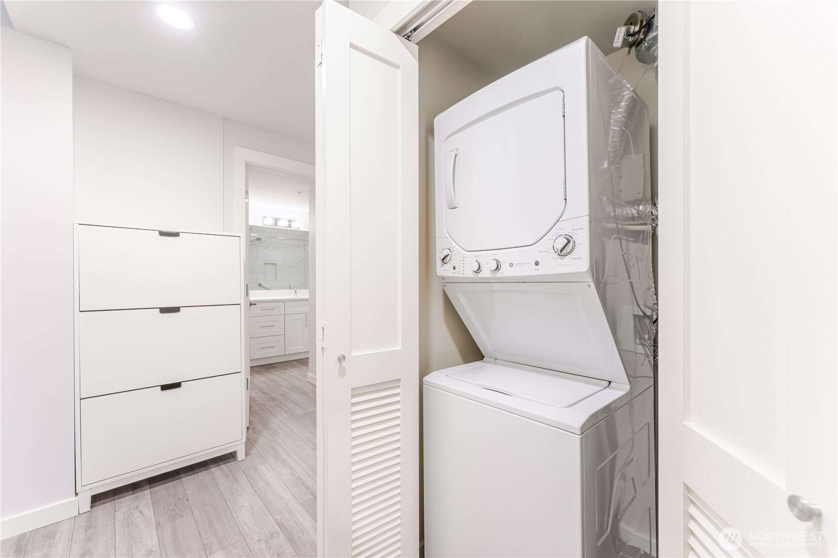 76 Cedar Street, Unit 303 Seattle, WA 98121 - Photo 17 of 29 a utility room with dryer and washer