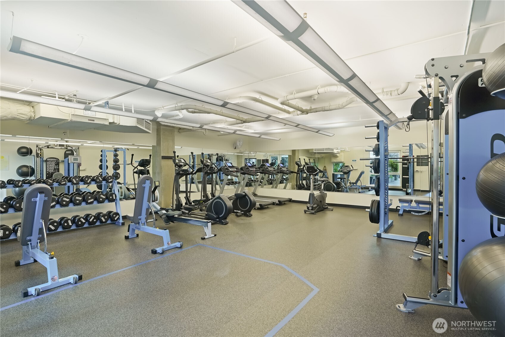 76 Cedar Street, Unit 303 Seattle, WA 98121 - Photo 21 of 29 a view of a room with gym equipment