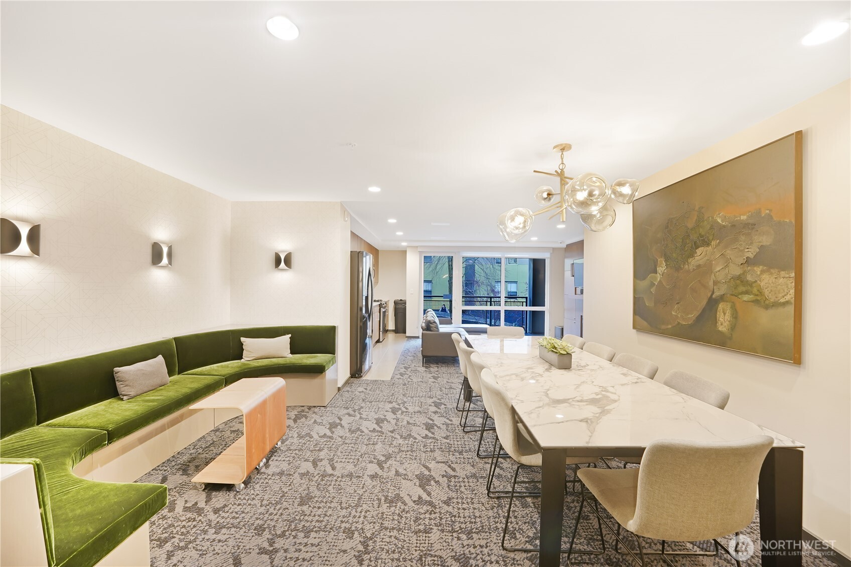76 Cedar Street, Unit 303 Seattle, WA 98121 - Photo 23 of 29 a living room with furniture and a chandelier
