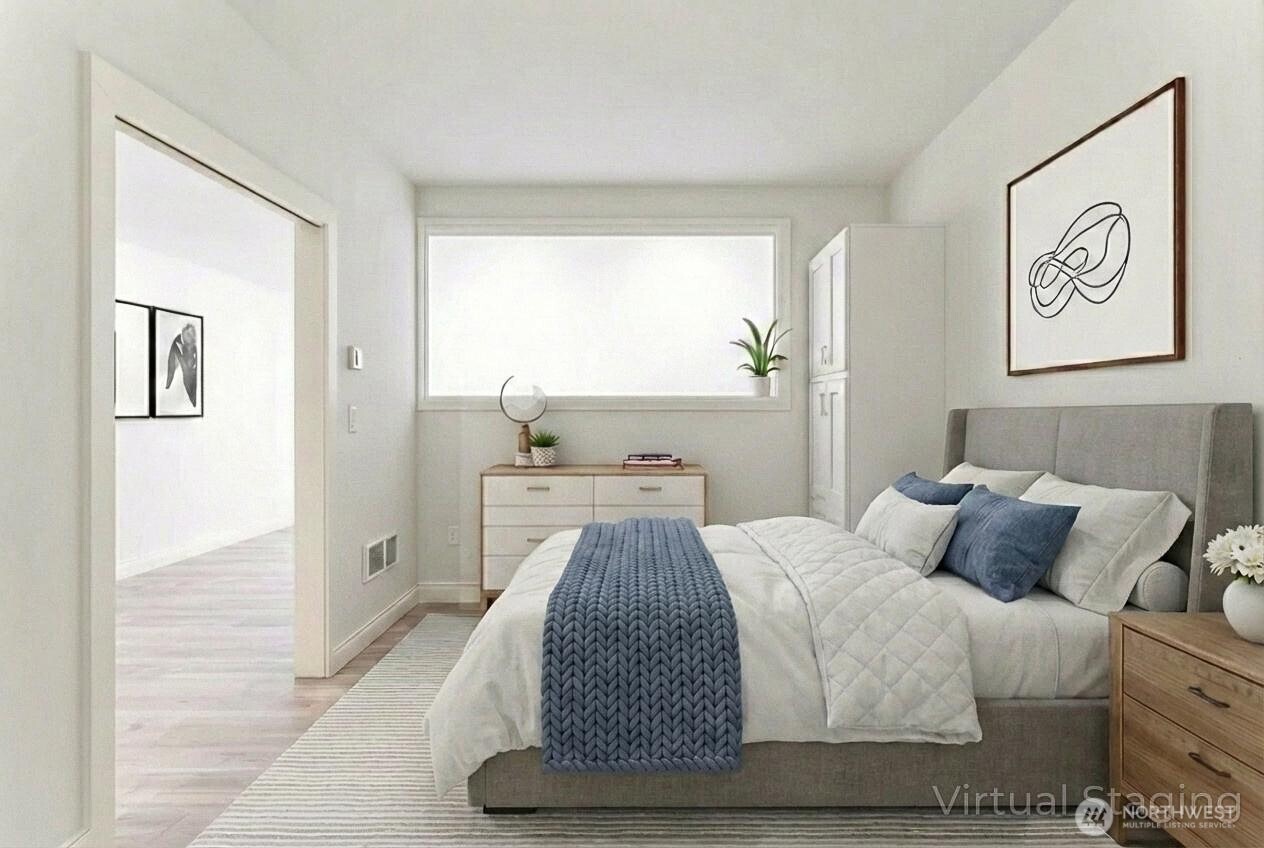76 Cedar Street, Unit 303 Seattle, WA 98121 - Photo 6 of 29 a bedroom with a bed and a window