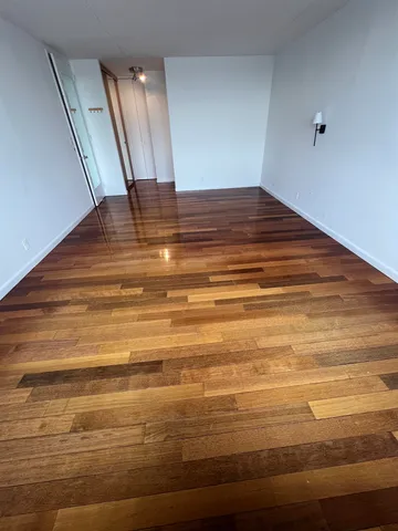 a view of room with wooden floor