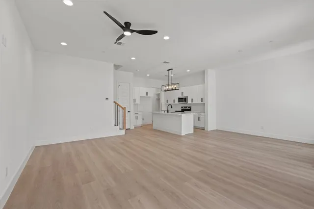 a view of kitchen with wooden floor and window