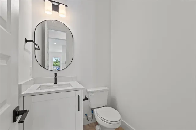 an empty room with a ceiling fan and a window