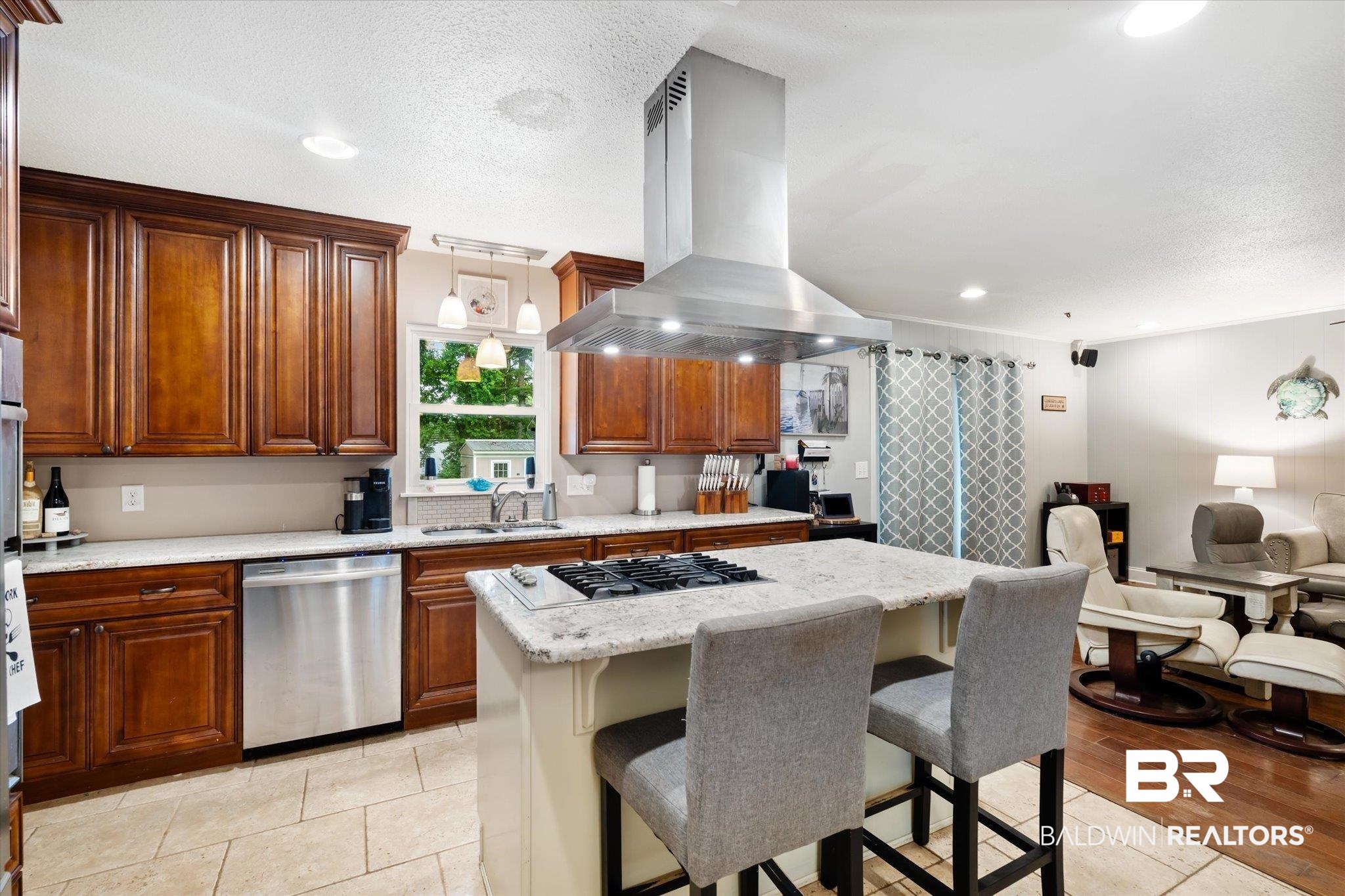 558 Stuart Street Daphne, AL 36526 - Photo 7 of 29 Kitchen with stainless steel appliances, island range hood, light hardwood / wood-style floors, a kitchen breakfast bar, and a center island