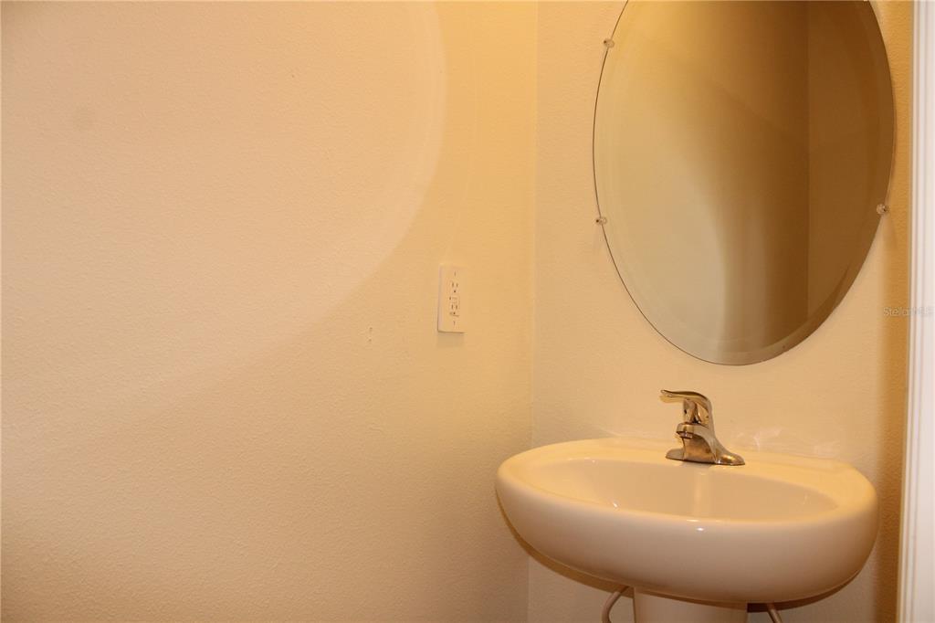 17567 Crescent Moon Loop Bradenton, FL 34211 - Photo 16 of 51 a bathroom with a sink and a mirror