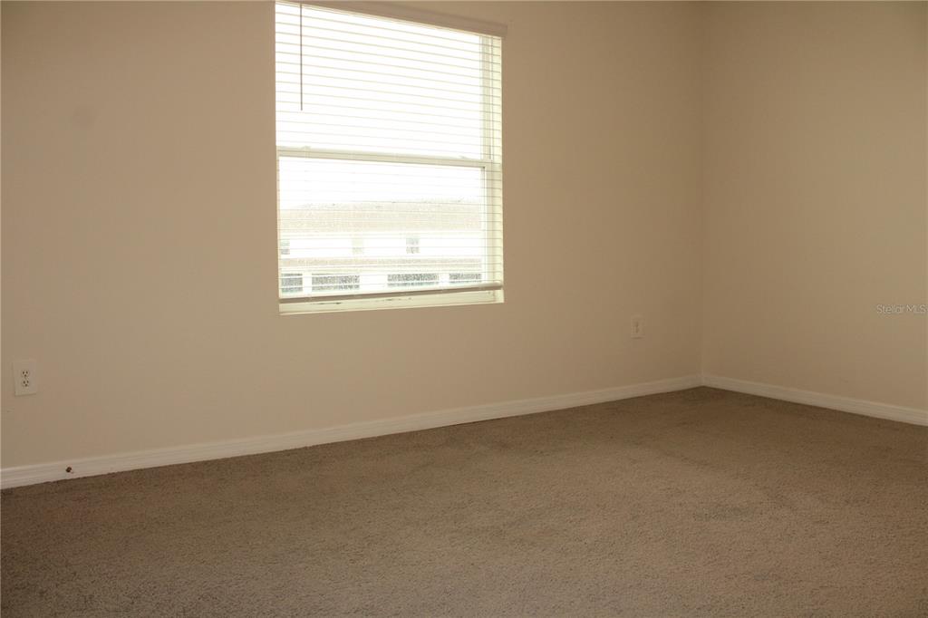 17567 Crescent Moon Loop Bradenton, FL 34211 - Photo 19 of 51 an empty room with a window