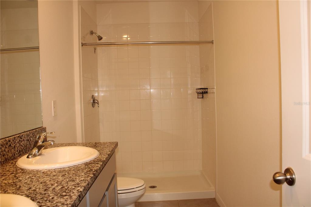 17567 Crescent Moon Loop Bradenton, FL 34211 - Photo 23 of 51 a bathroom with a sink and a mirror