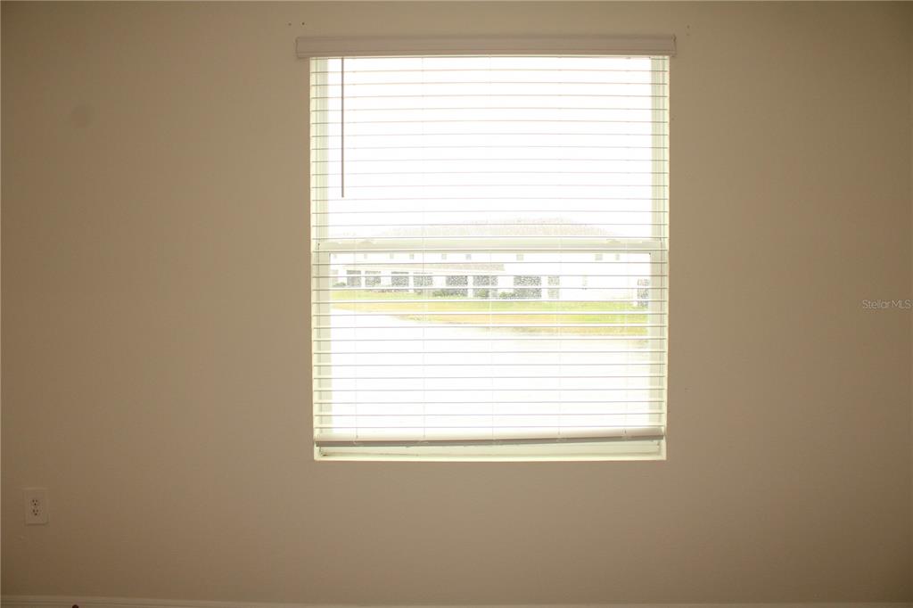 17567 Crescent Moon Loop Bradenton, FL 34211 - Photo 24 of 51 a view of a room that has a window in it