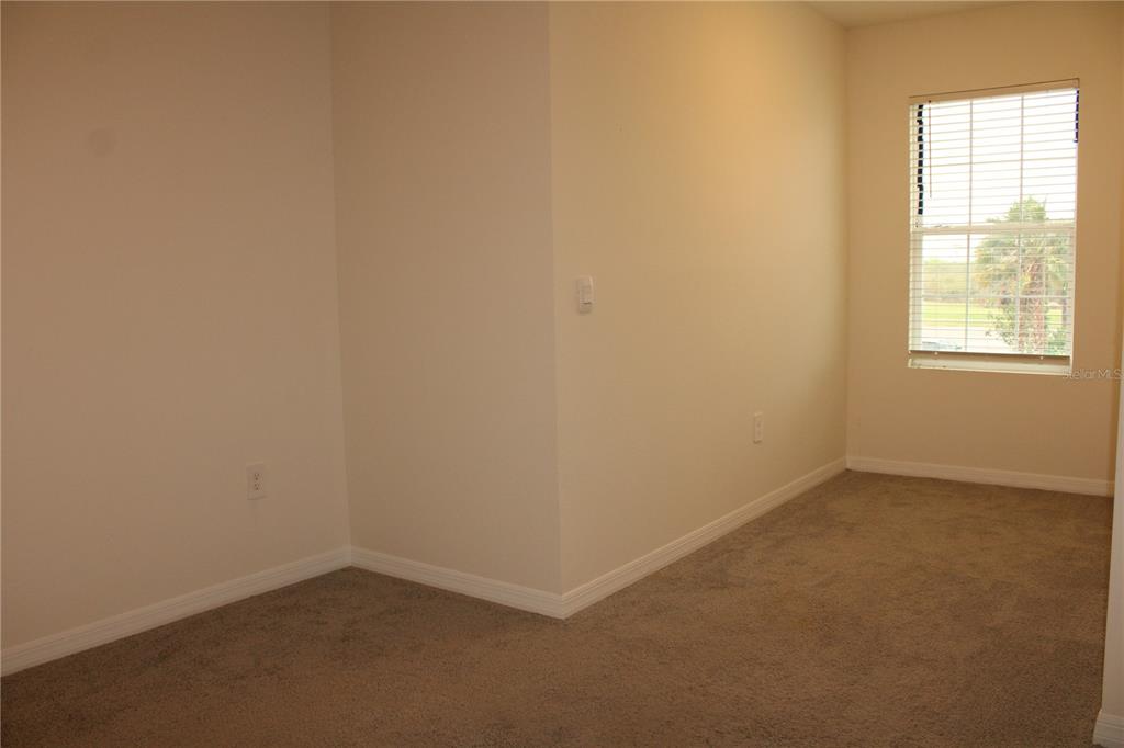 17567 Crescent Moon Loop Bradenton, FL 34211 - Photo 28 of 51 an empty room with a window