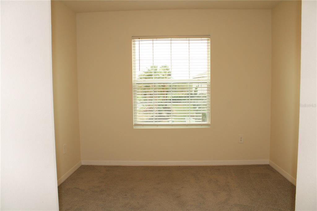 17567 Crescent Moon Loop Bradenton, FL 34211 - Photo 31 of 51 a view of an empty room with a window