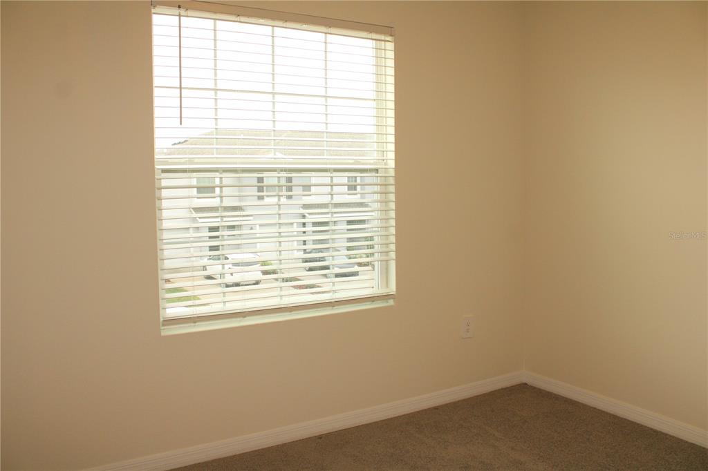 17567 Crescent Moon Loop Bradenton, FL 34211 - Photo 33 of 51 a view of an empty room with a window