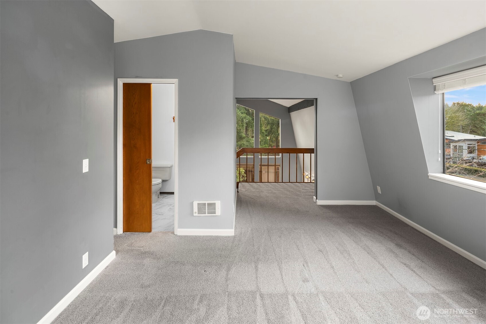 1504 Northeast 107th Street Seattle, WA 98125 - Photo 14 of 35 an empty room with windows and closet