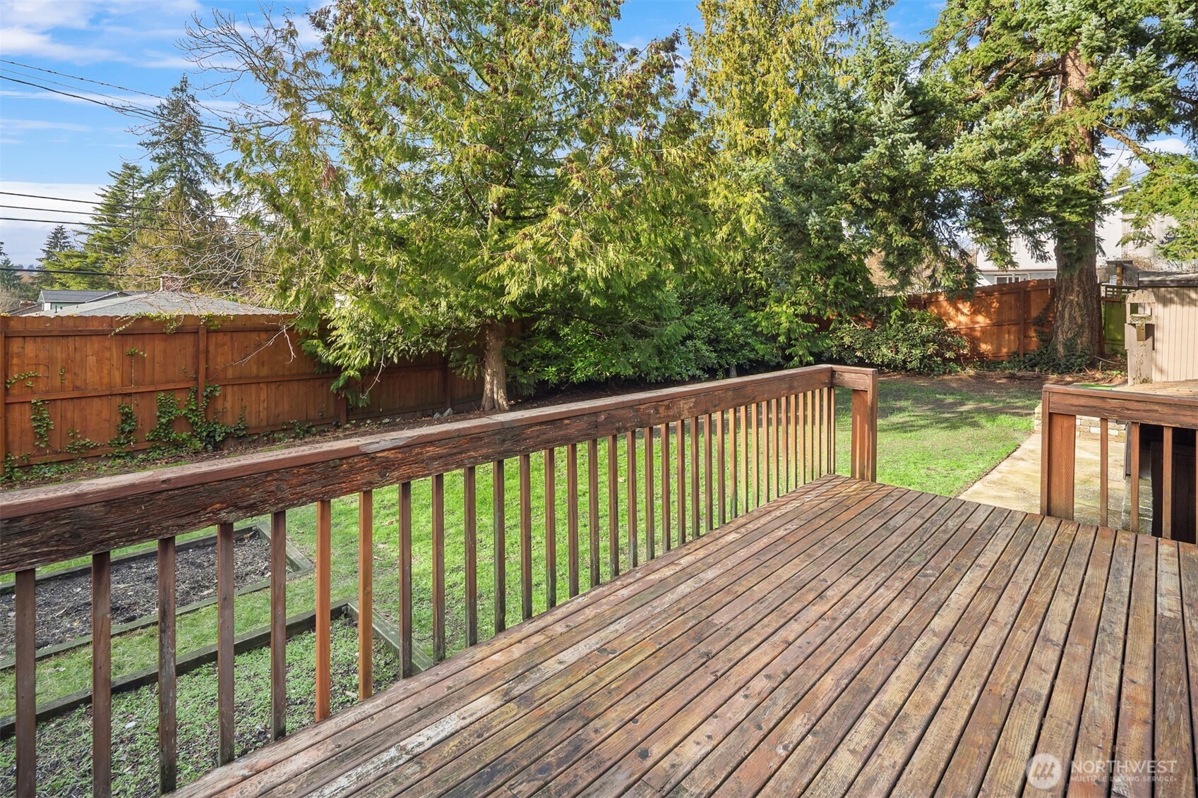 1504 Northeast 107th Street Seattle, WA 98125 - Photo 20 of 35 a view of balcony with wooden floor and fence