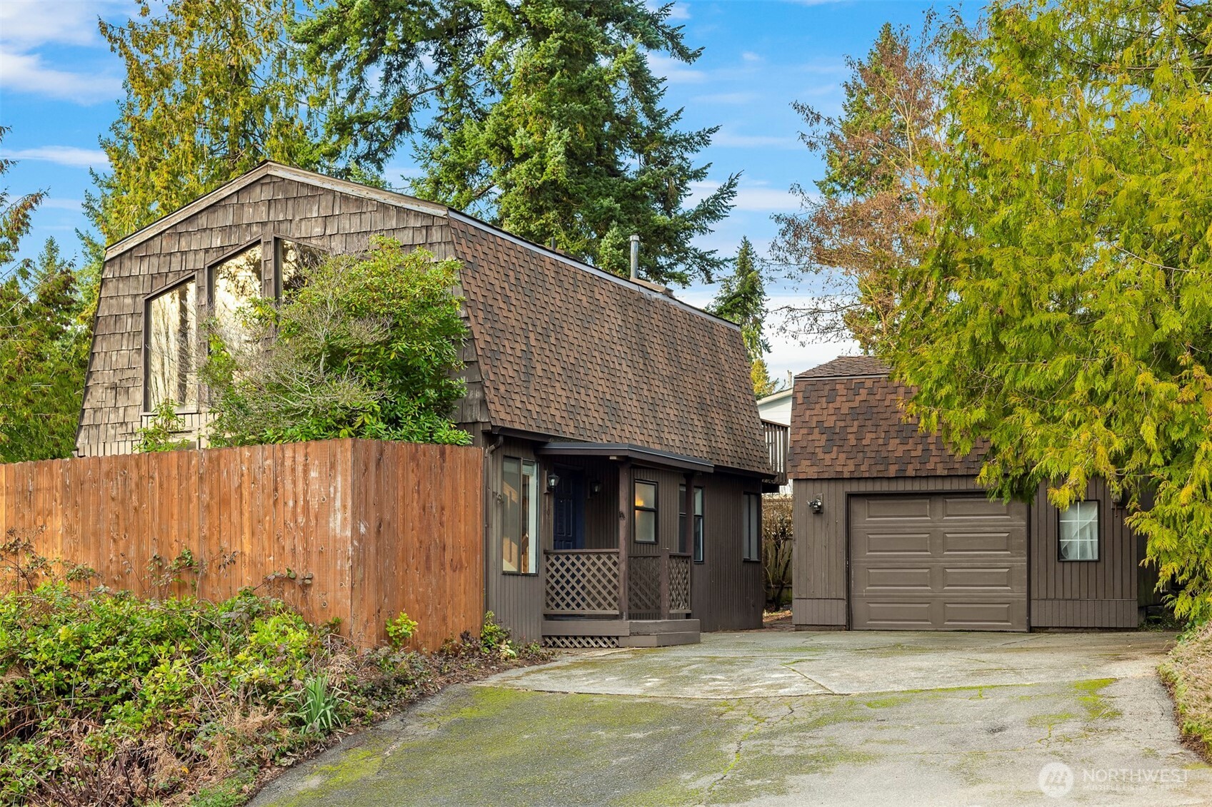 1504 Northeast 107th Street Seattle, WA 98125 - Photo 22 of 35 a front view of a house with a garden