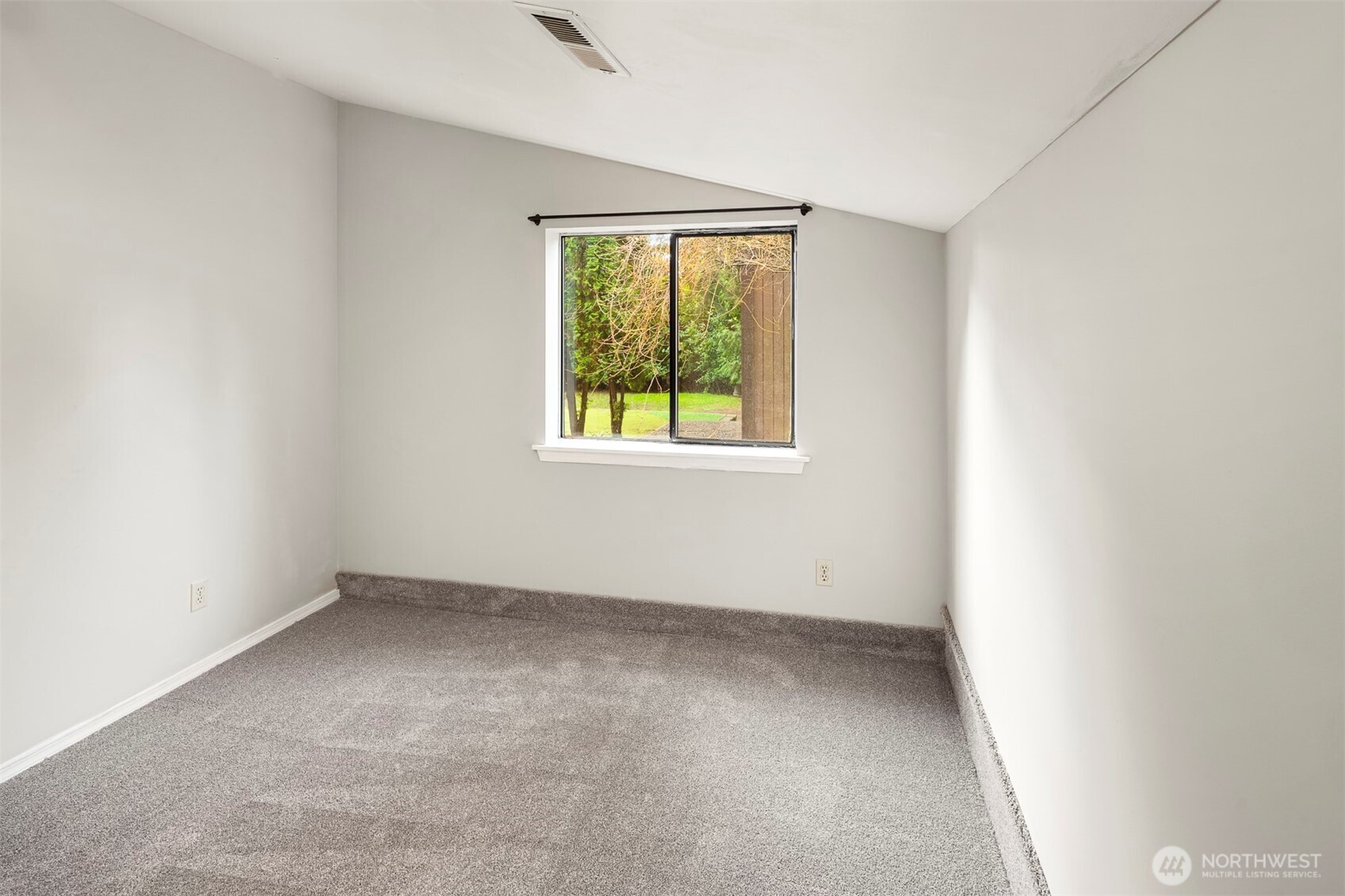 1504 Northeast 107th Street Seattle, WA 98125 - Photo 27 of 35 an empty room with a window