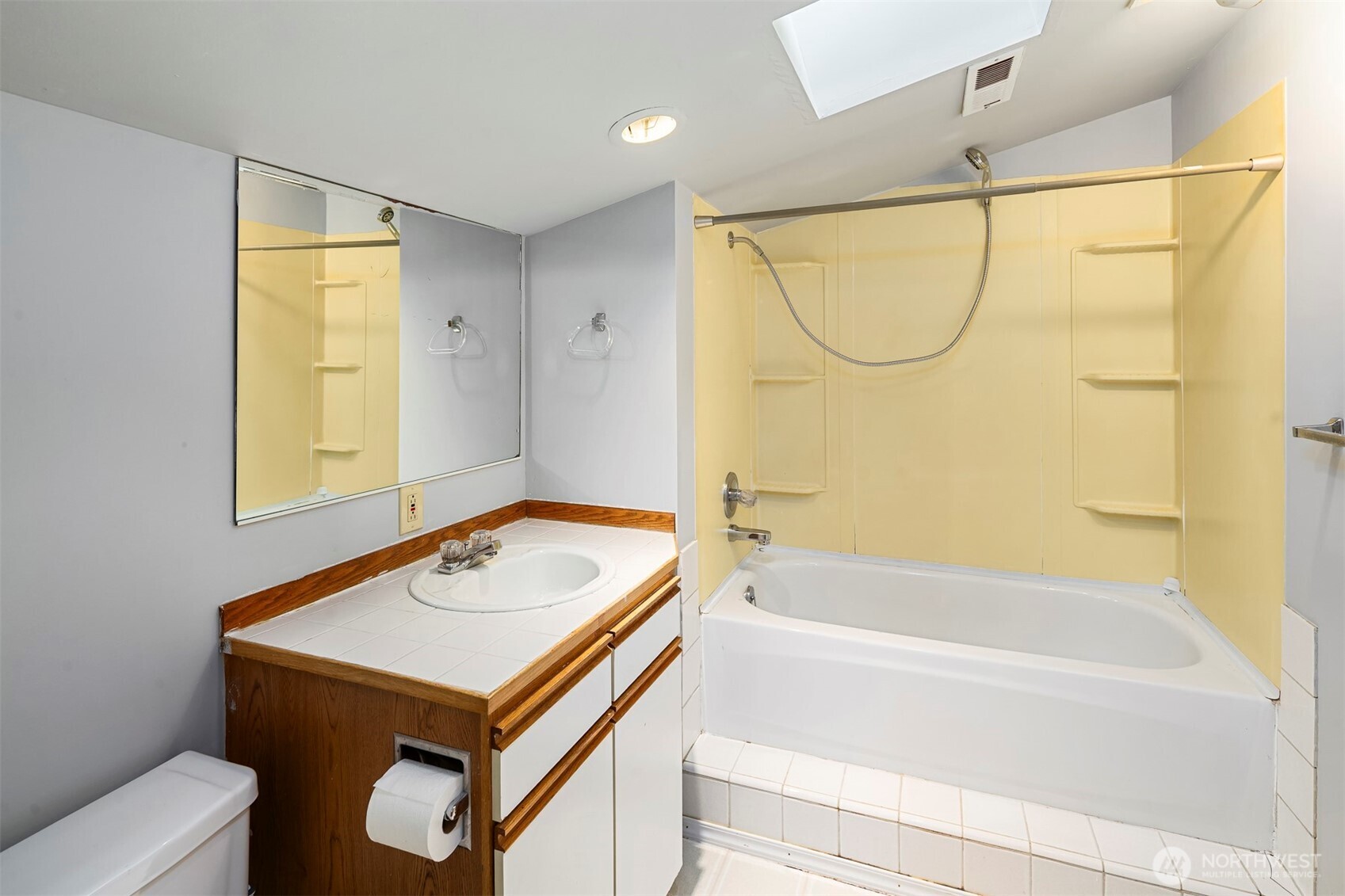 1504 Northeast 107th Street Seattle, WA 98125 - Photo 29 of 35 a bathroom with a sink and a mirror