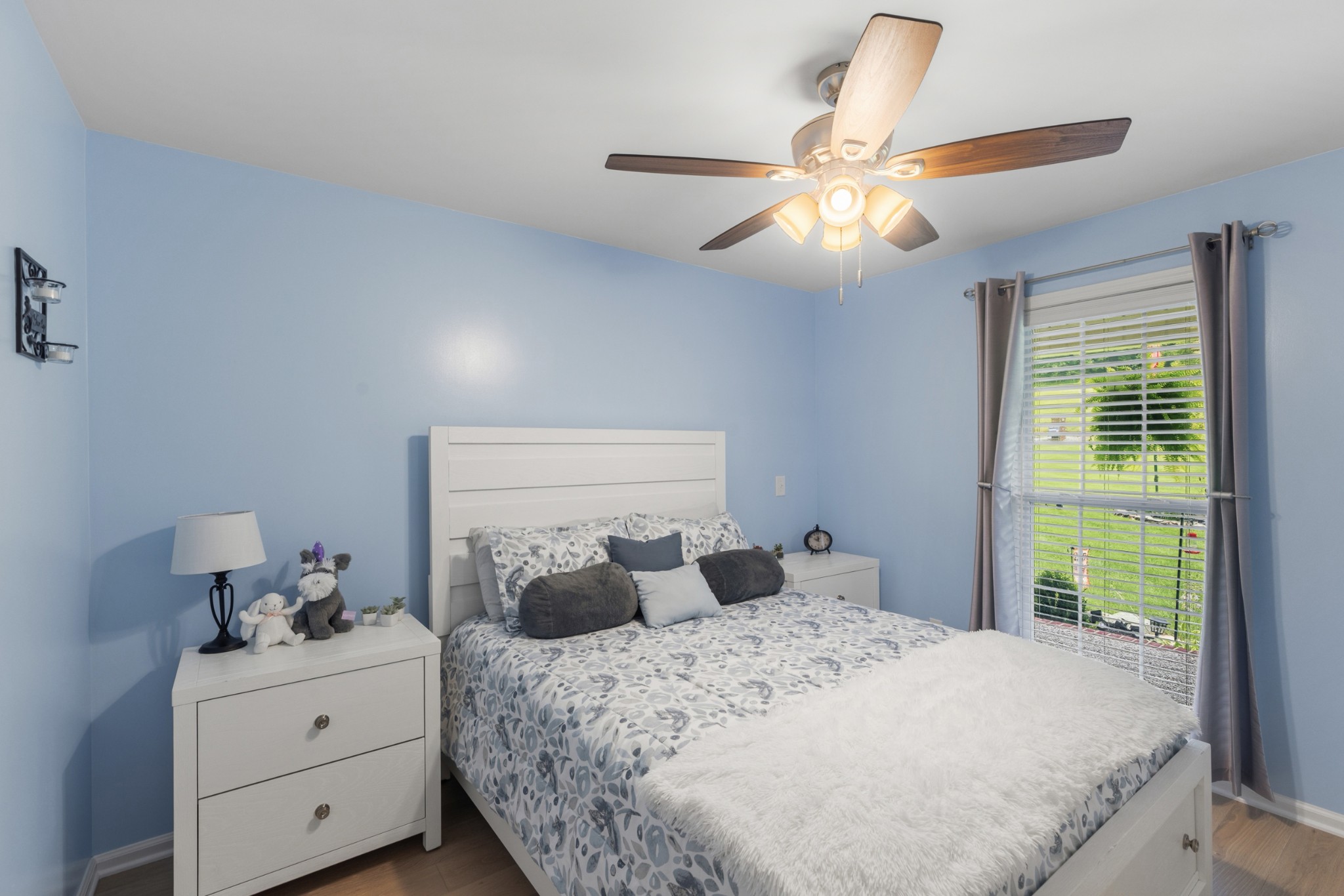 454 Campbell Hollow Road Bethpage, TN 37022 - Photo 41 of 57 a bedroom with a bed and a chandelier