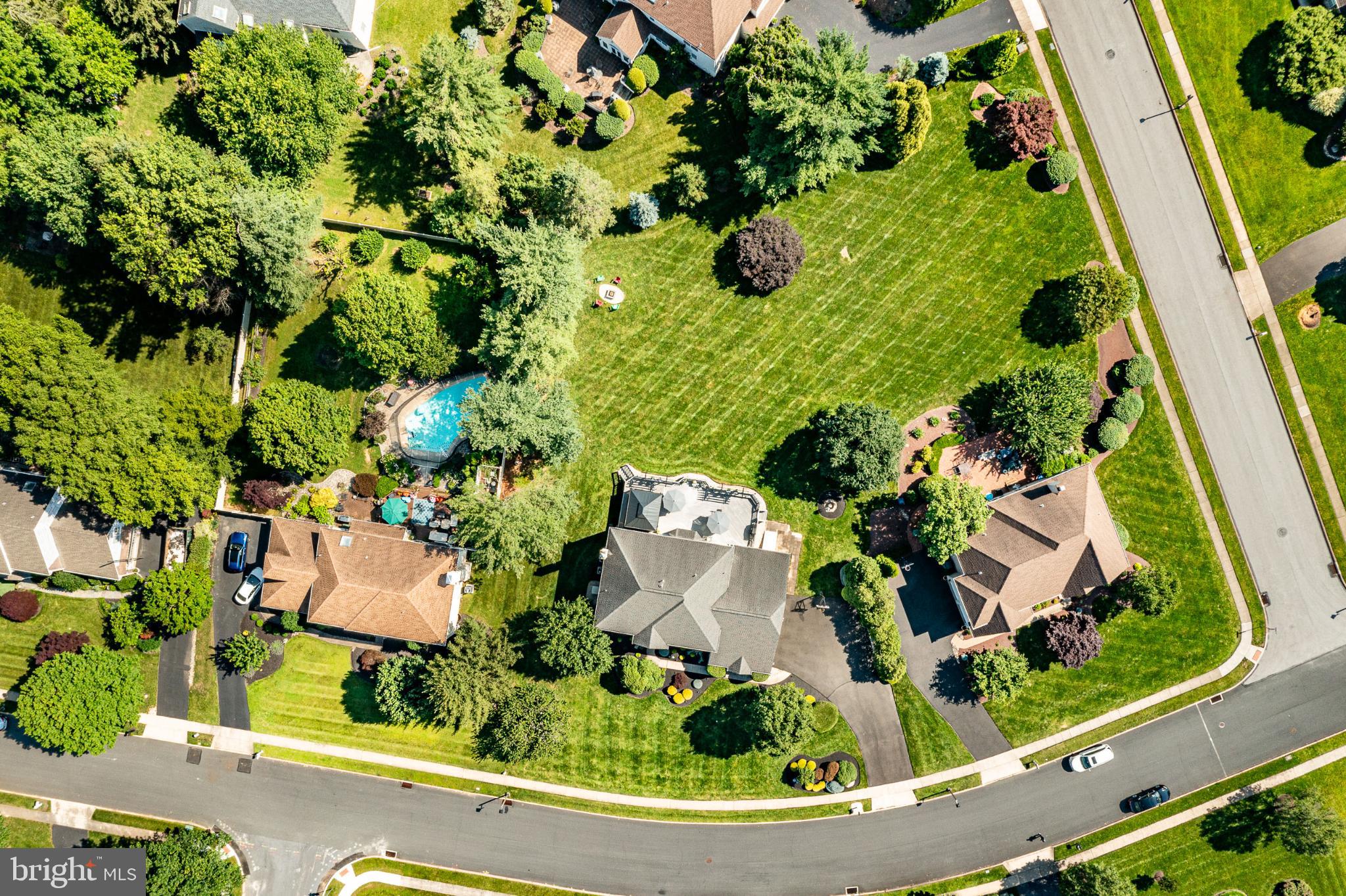 1716 St Georges Road Dresher, PA 19025 - Photo 27 of 90 Lush suburban oasis with vibrant greenery.