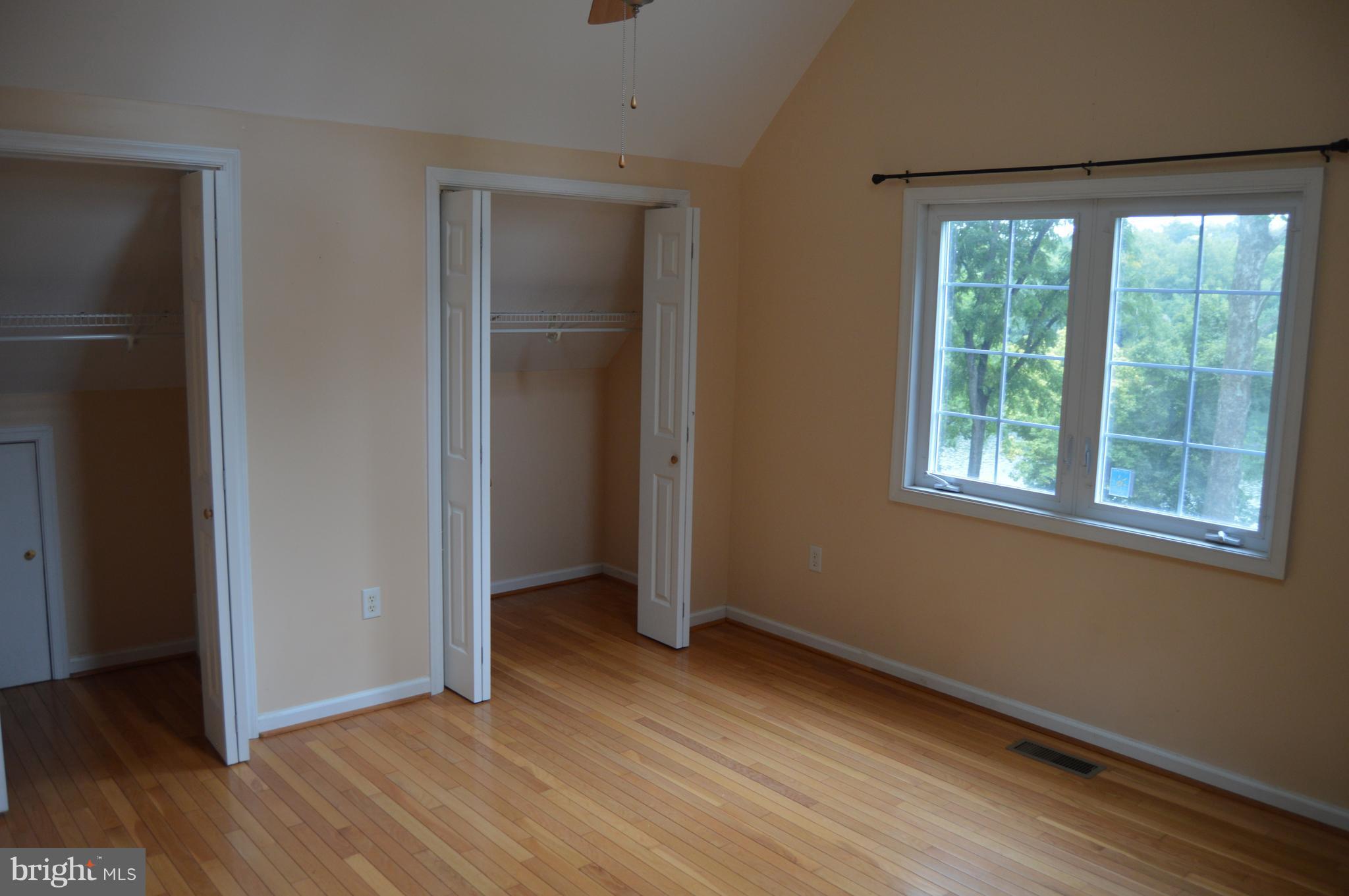 1529 Knott Road Shepherdstown, WV 25443 - Photo 12 of 20 an empty room with wooden floor and windows