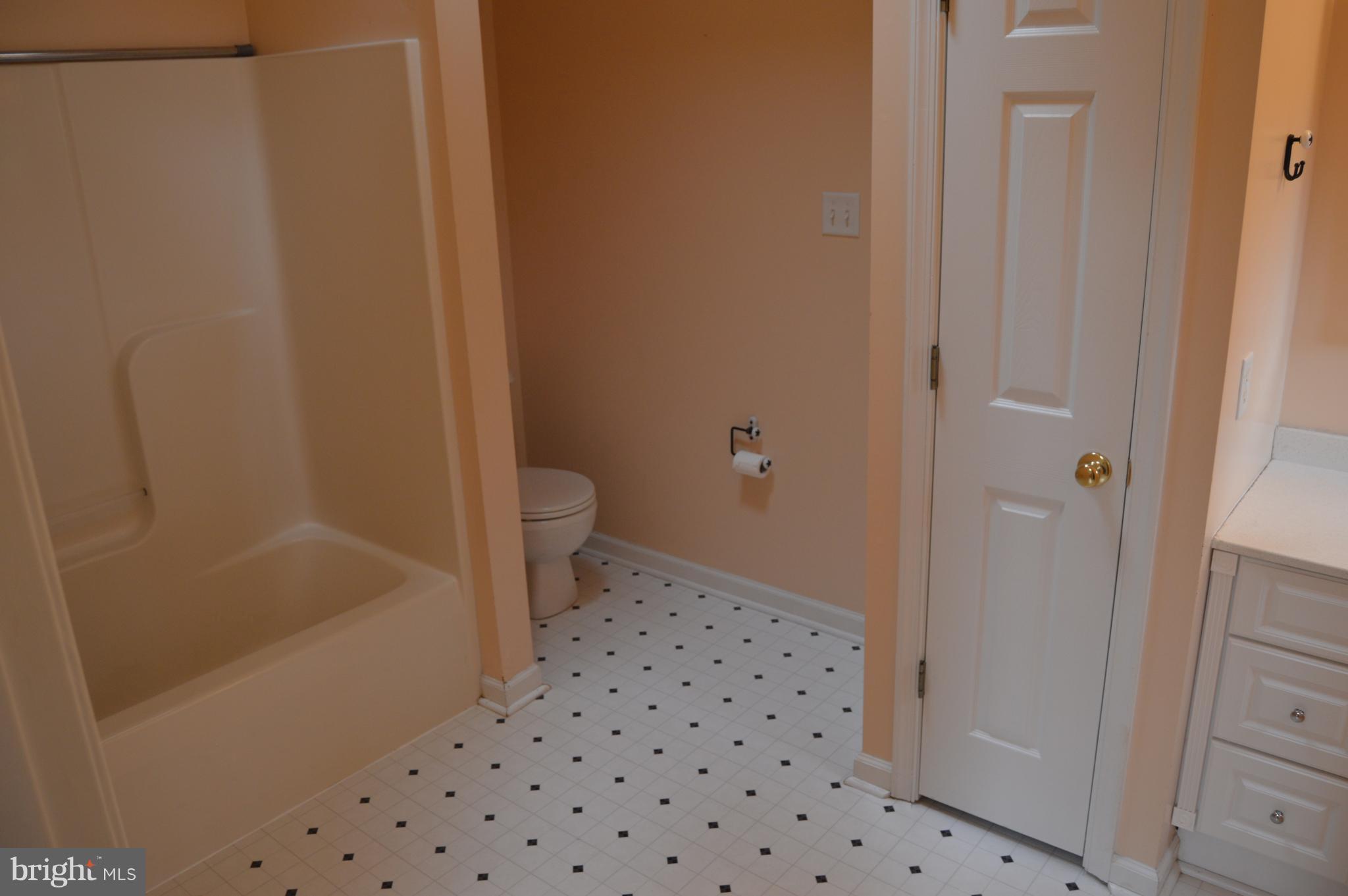 1529 Knott Road Shepherdstown, WV 25443 - Photo 14 of 20 a bathroom with a bathtub and a toilet