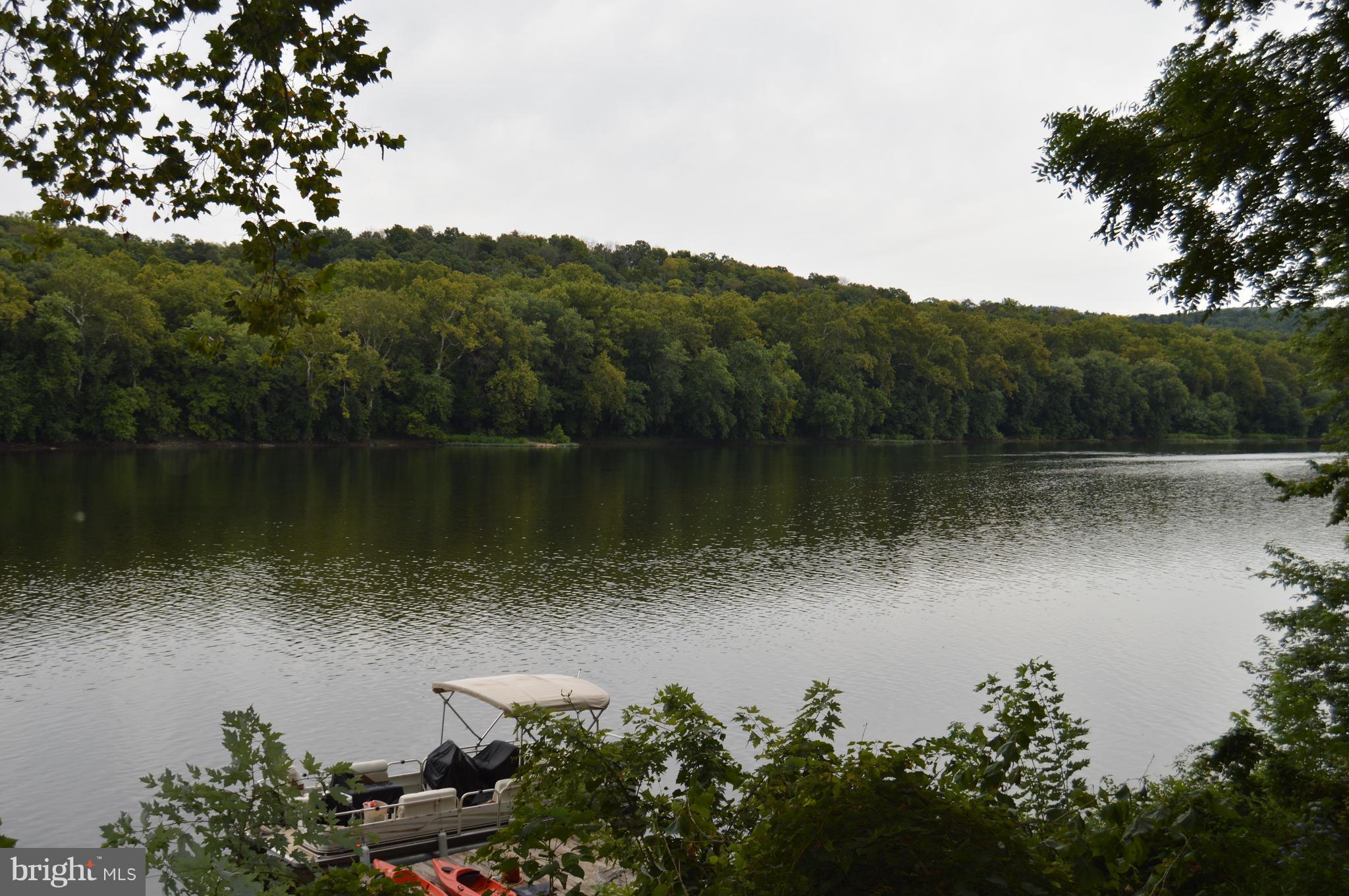 1529 Knott Road Shepherdstown, WV 25443 - Photo 3 of 20 a view of a lake with a mountain in the background