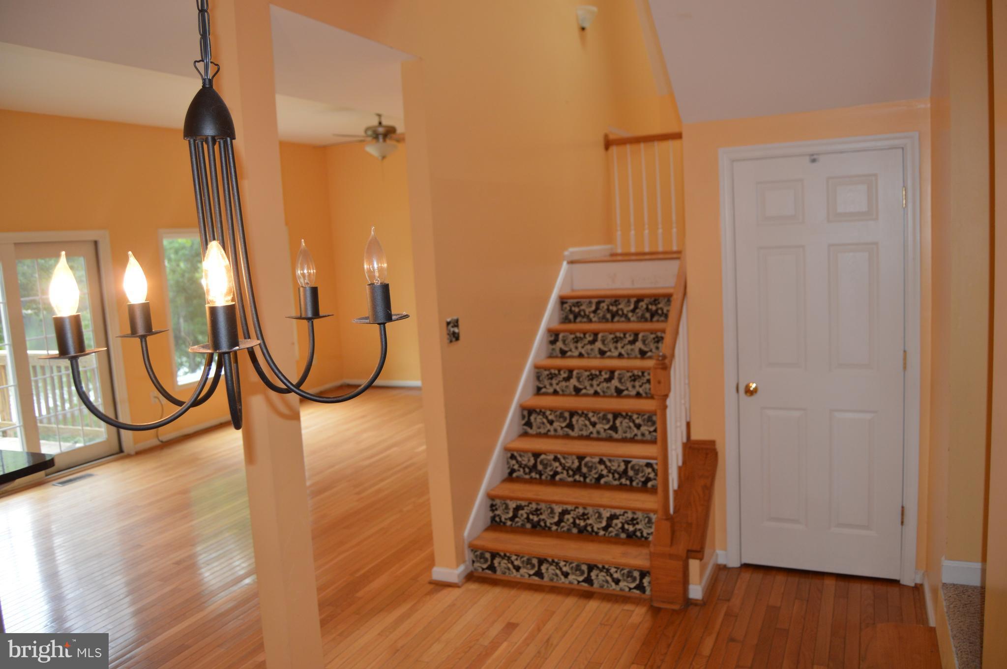 1529 Knott Road Shepherdstown, WV 25443 - Photo 10 of 20 a view of a room with stairs and wooden floor