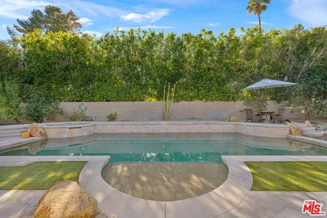 a living room with fireplace furniture and a flat screen tv