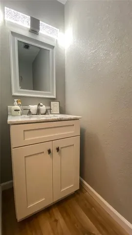 a bedroom with a bed and a view of kitchen