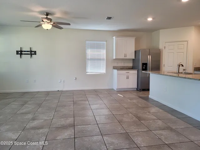 a view of a kitchen with a stove cabinets and a kitchen