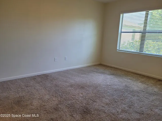 a bathroom with a shower sink and mirror