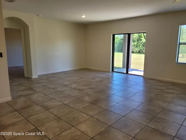 a large kitchen with stainless steel appliances granite countertop a large counter top and a stove top oven