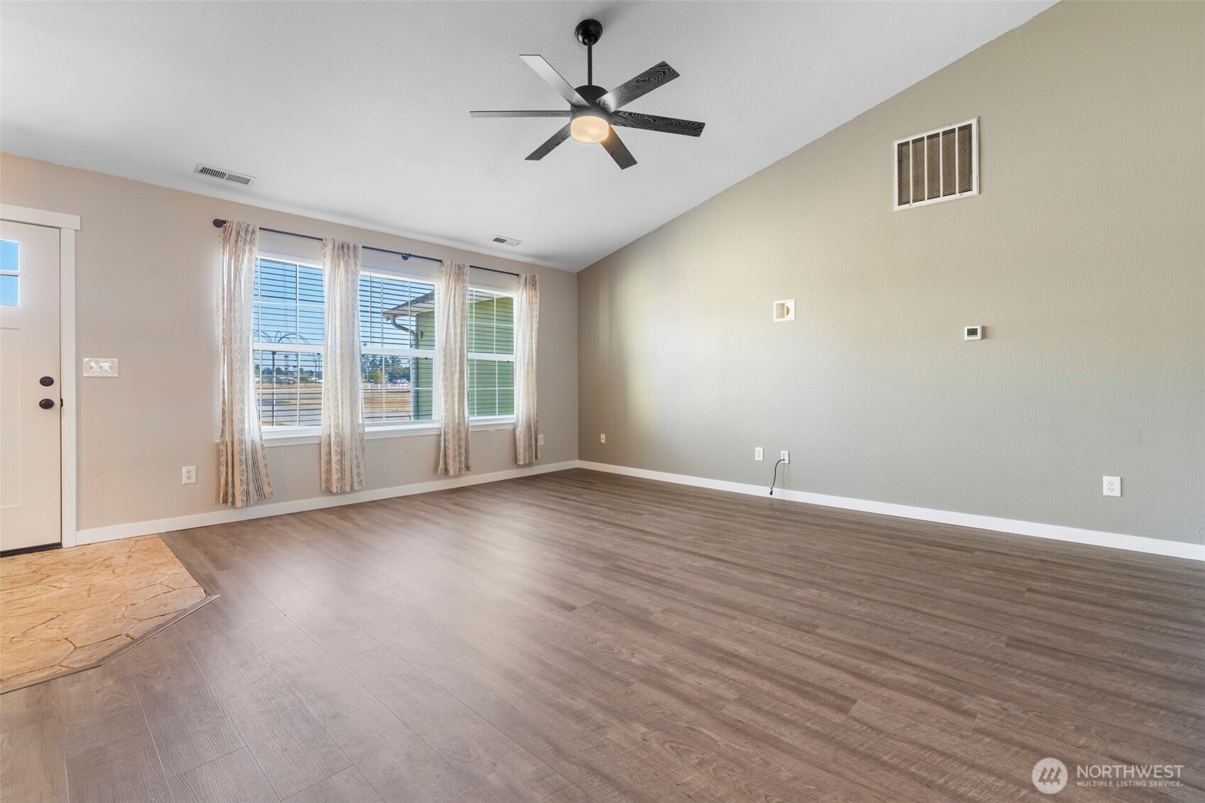 9523 184th Avenue Southwest Rochester, WA 98579 - Photo 8 of 40 wooden floor in an empty room with a window