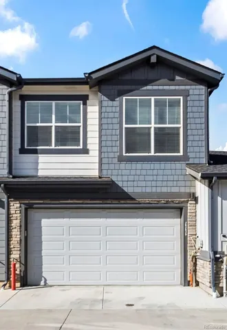 a front view of a house with a garage