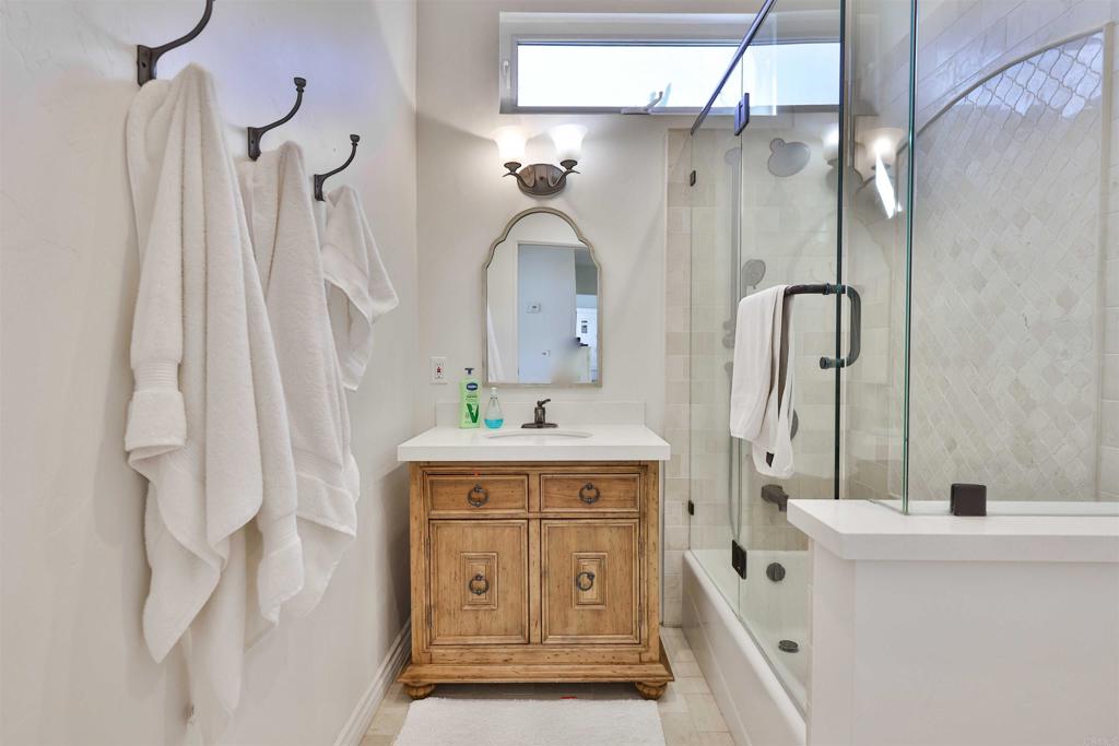 408 5th Street Coronado, CA 92118 - Photo 27 of 56 a bathroom with a sink vanity and a mirror