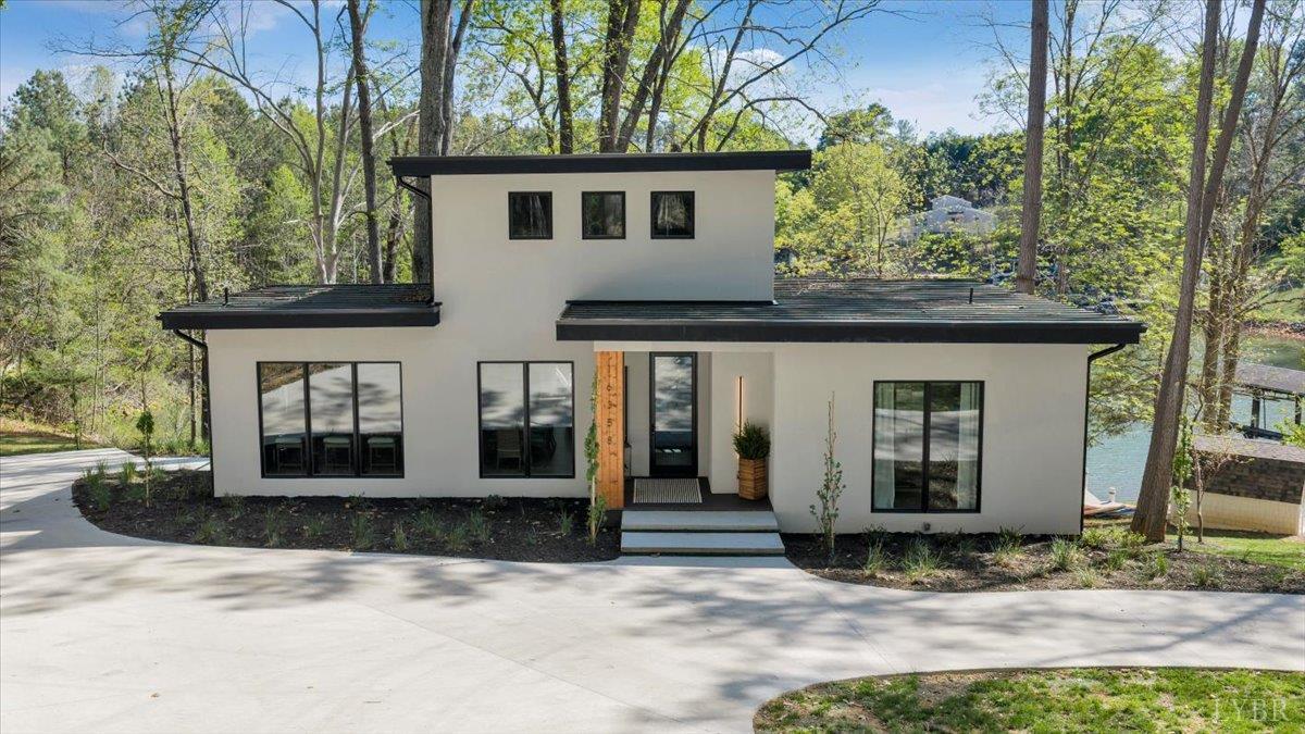 THIS PROPERTY IS ON COUNTY SEWER AT THE LAKE!  This contemporary new construction lake front home is located at one of the most convenient locations on the lake! Only minutes to Bridgewater offering marina, shopping, dining, live music, coffee shop, ice cream, mini golf, and more!