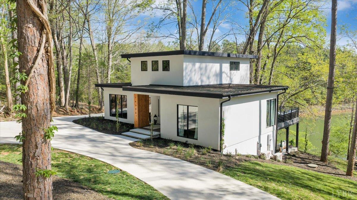 16358 Moneta Road Moneta, VA 24121 - Photo 3 of 78 Whether you’re seeking a full-time residence, a private retreat, or an income-producing investment, this exceptional new construction seamlessly blends modern architecture with high-end finishes.