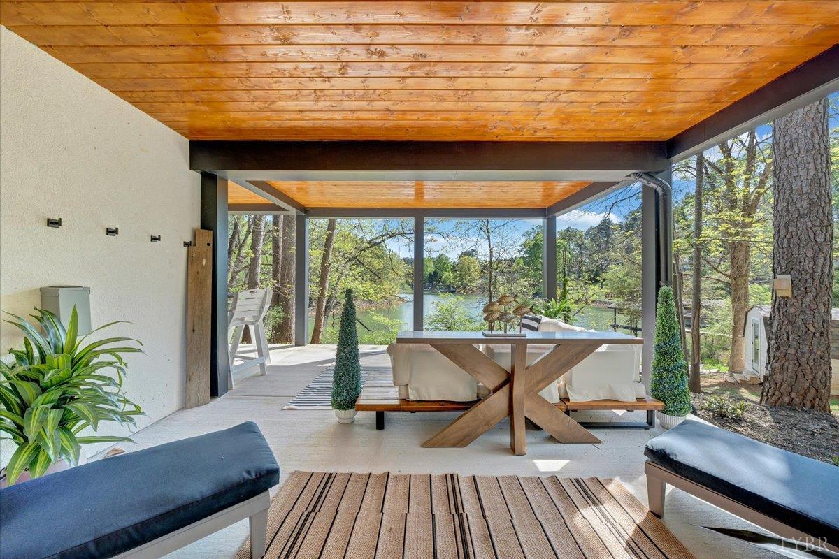 16358 Moneta Road Moneta, VA 24121 - Photo 5 of 78 a seamless blend of elegance and openness, this property features expansive outdoor living areas to rival its sophisticated indoor spaces overlooking the breathtaking beauty of Smith Mountain Lake!