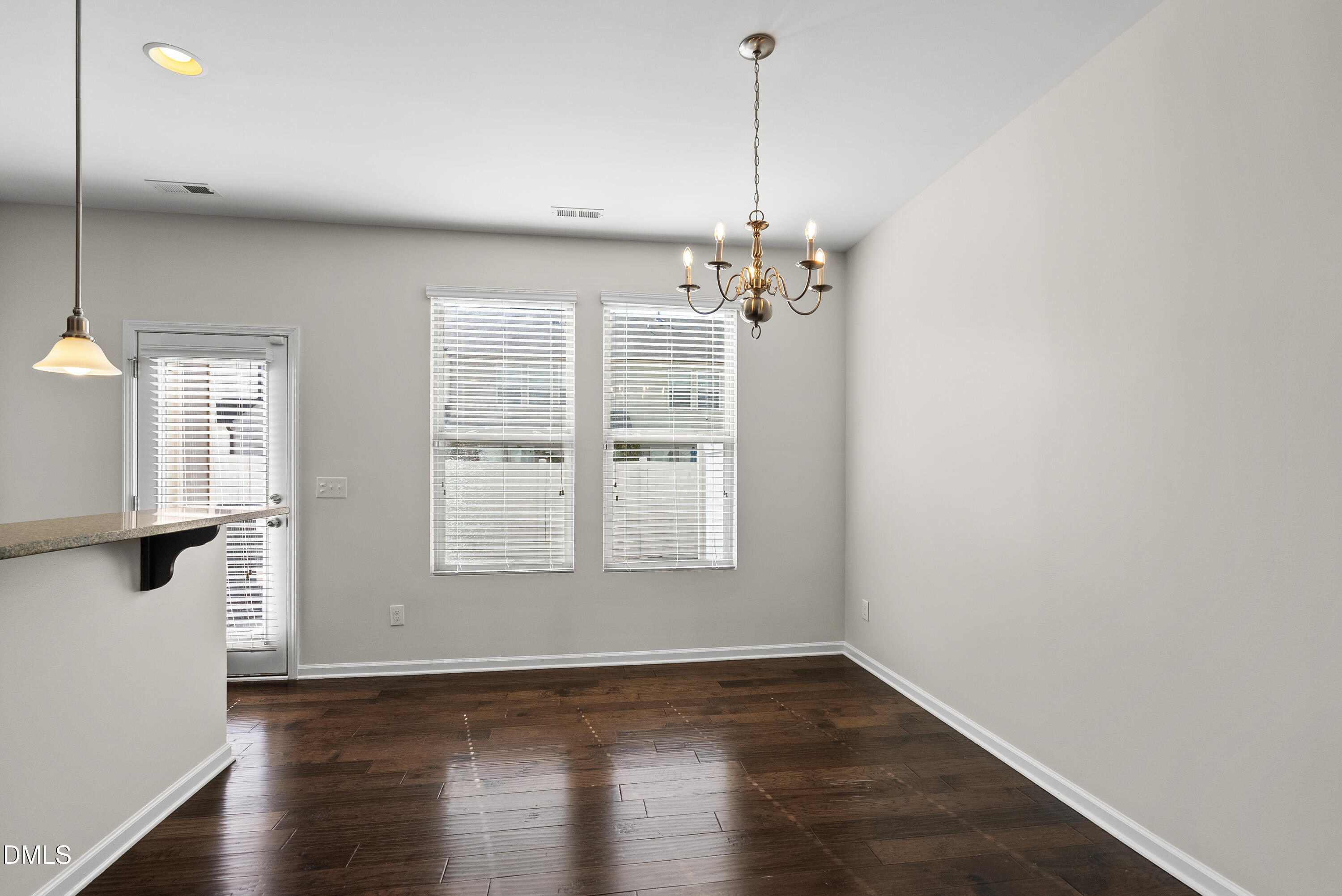 309 Leighann Ridge Lane Rolesville, NC 27571 - Photo 11 of 25 a view of an empty room with wooden floor and a window